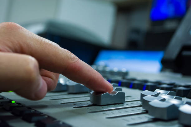 istock hand on a light, mixing desk fader in blur television gallery 888100160