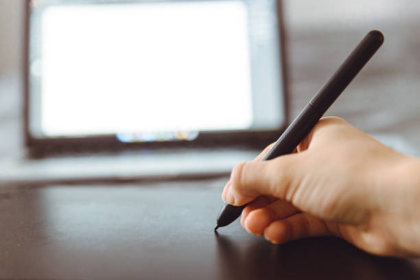 istock Graphic Tablet Being Used with a Pen by Female Hand 888100192