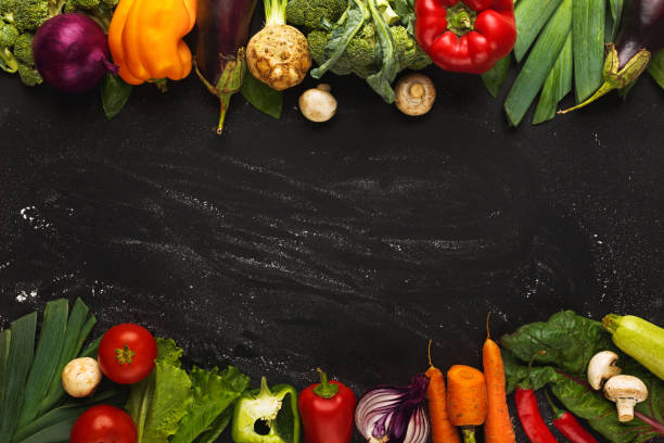 istock Border of fresh vegetables on wooden background with copy space 888100802