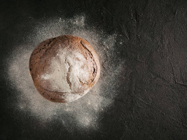 istock Whole homemade rye bread top view copyspace 888106294