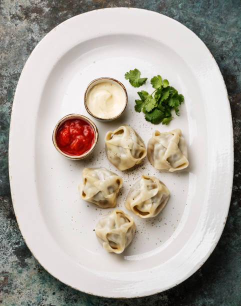istock steamed dumplings Manty with sauce 888106780