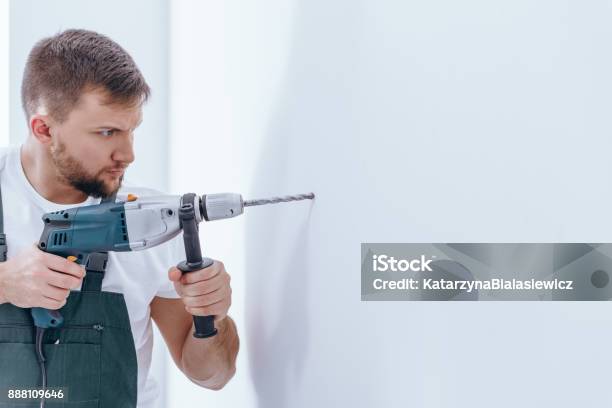 Male With A Drill Stock Photo - Download Image Now - Drill, Wall - Building Feature, Hole