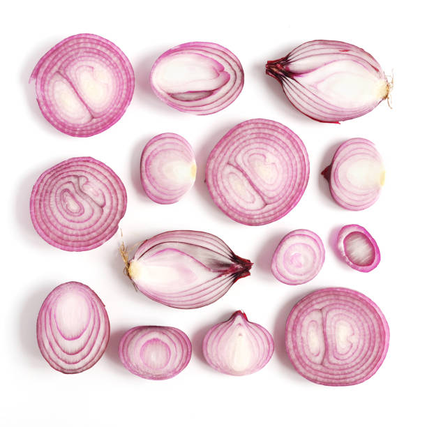 istock Pink onion pattern. Slices of onion on a white background. Top view, flat design. 888110514