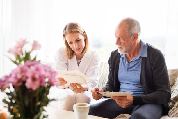 istock Health visitor and a senior man during home visit. 888113990