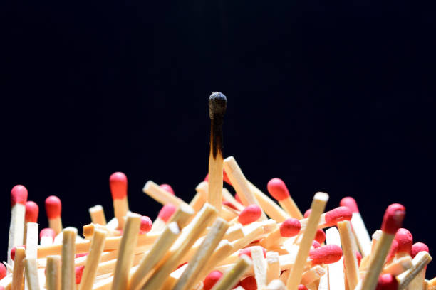 istock Vertically stacked Burned matche and pile of matches 888116930