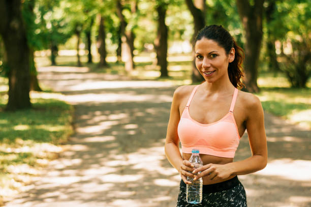 istock Fitness woman taking a break after running workout. 888117106