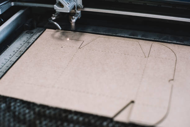 istock Laser cutting a gift box out of the cardboard 888119844