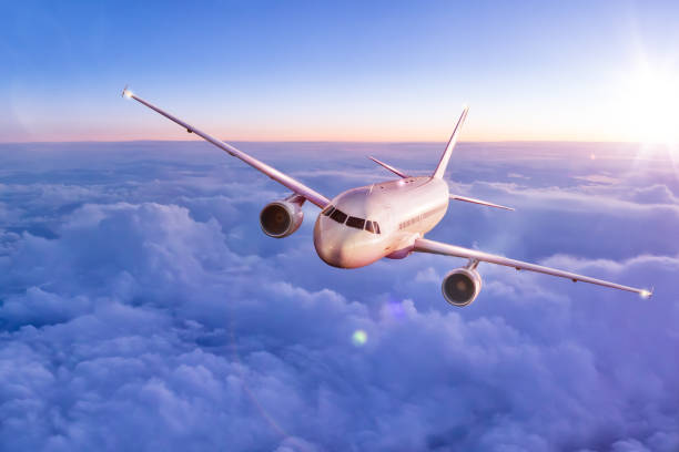 istock Commercial airplane flying above clouds 888120328