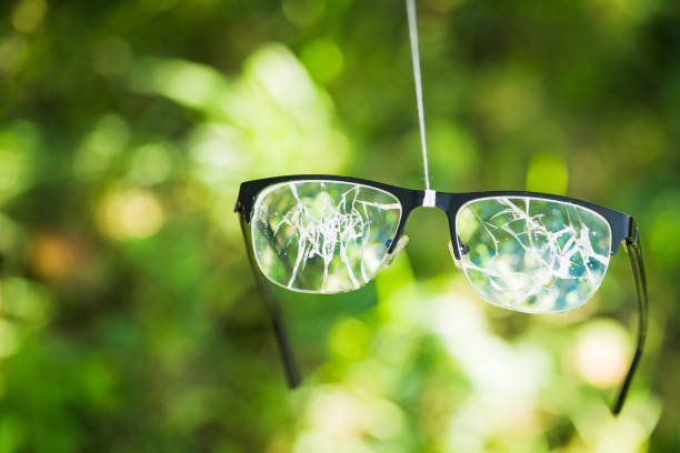 istock broken glasses on the green background 888120494
