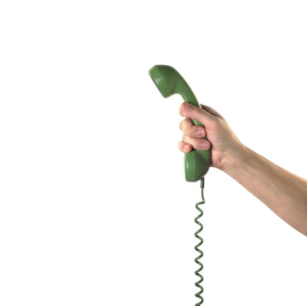 istock Objects Hands action - Hand holds retro phone green handset. Isolated 888133412