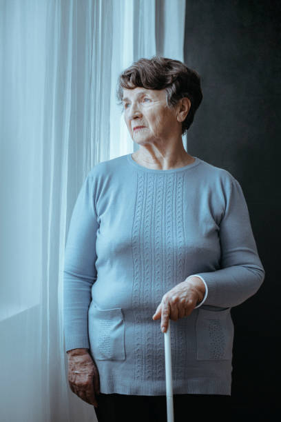 istock Blind lonely woman with cane 888139792