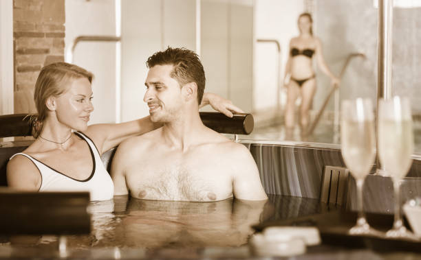 istock Couple is drinking champagne in spa 888140198