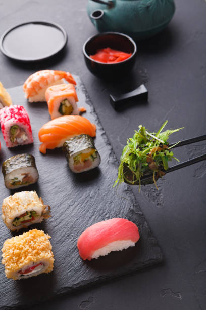 istock Eating sushi at restaurant, japanese cuisine 888146126