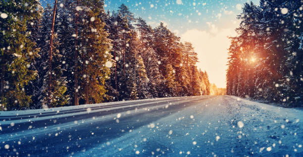istock Car tires on winter road 888146298