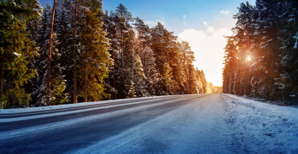 istock Car tires on winter road 888146378