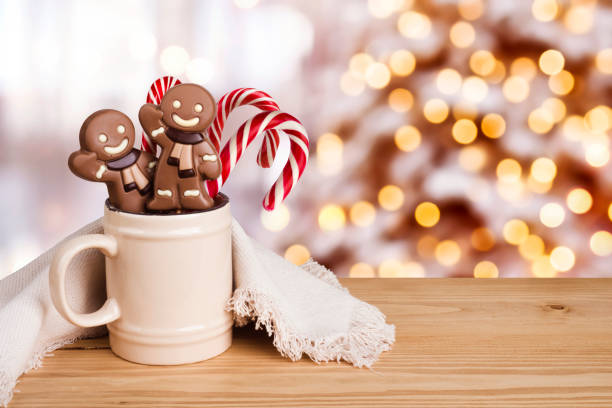 istock Gingerbread man and candy in dish over abstract holiday background 888150436