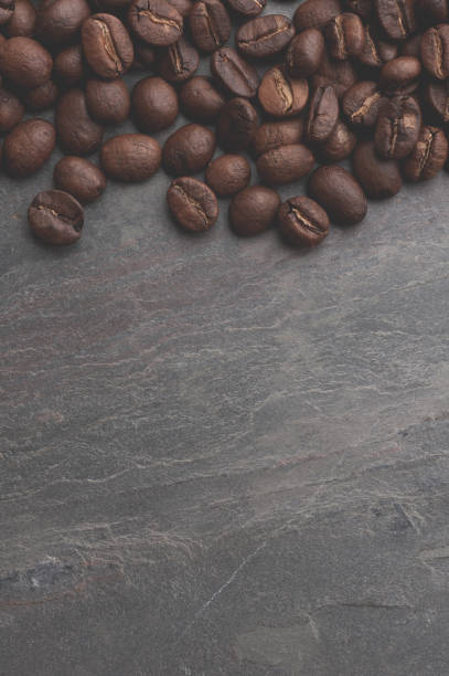 istock Coffee beans on stone background. Top view with copy space for your text 888150514