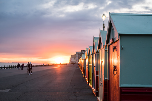 Colorful Beach Huts during sunset at Brighton and Hove, England