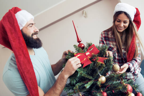 istock Young man giving his girlfriend Christmas present 888153400