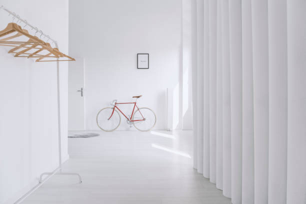 istock Wooden clothes hangers in hall 888158206