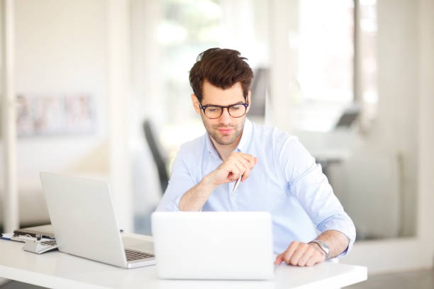 istock Handsome businessman at office 888167410