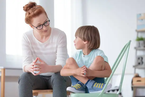 Photo of School psychologist with smart boy