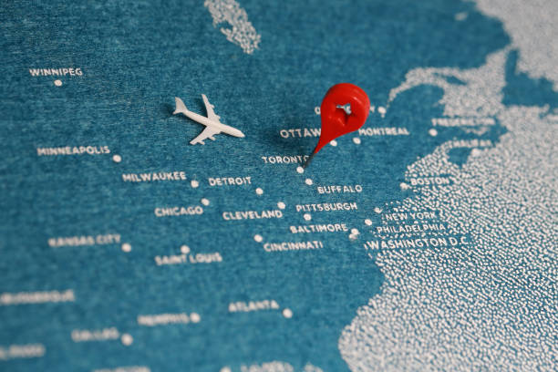 istock airplane fly on the blue felt painted map, north america 888173852