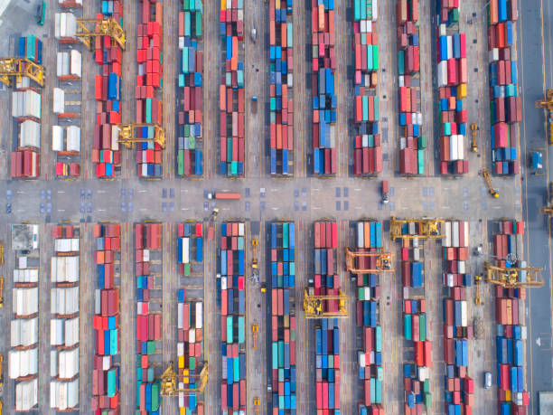 istock container,container ship in import export and business logistic,By crane,Trade Port , Shipping,cargo to harbor.Aerial view,Water transport,International,Shell Marine,transportation,logistic,trade,port 888184176