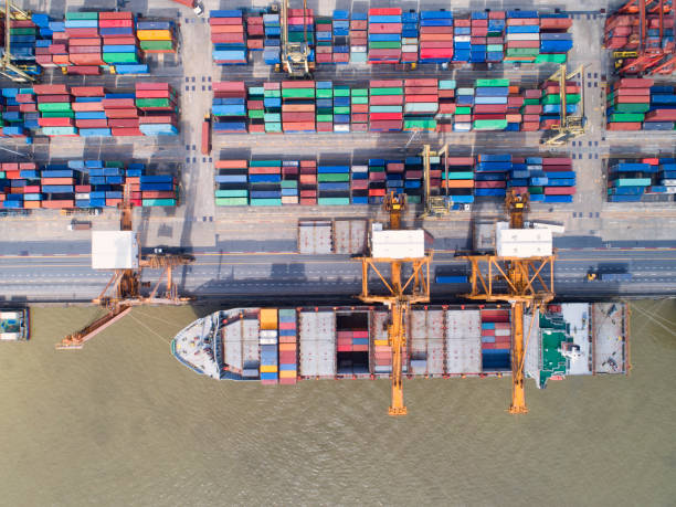 istock container,container ship in import export and business logistic,By crane,Trade Port , Shipping,cargo to harbor.Aerial view,Water transport,International,Shell Marine,transportation,logistic,trade,port 888184208