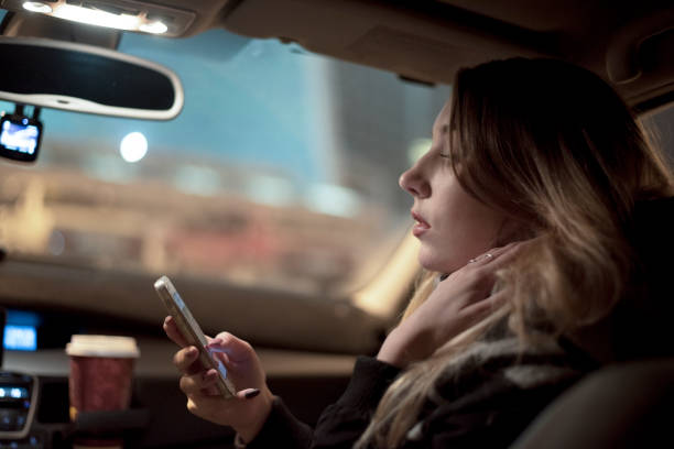 istock Smiling passenger woman using cellphone 888193754