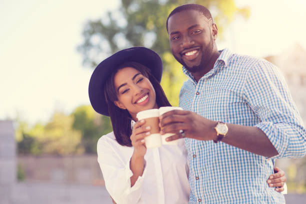 istock Joyful positive couple having coffee 888195952