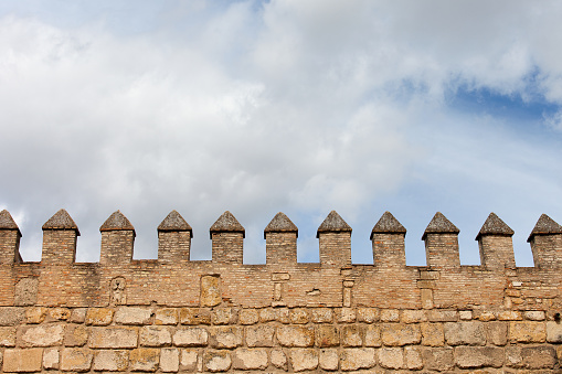 Fortified wall battlement, medieval castle fortification background