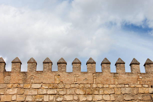 Castle Wall Battlement Background Fortified wall battlement, medieval castle fortification background fortified wall stock pictures, royalty-free photos & images