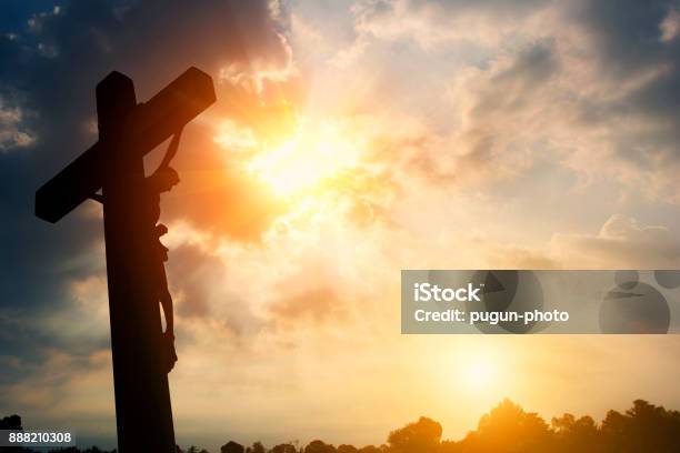 Silhouette Crucifixion Of Jesus Christ And The Sunset Stock Photo - Download Image Now