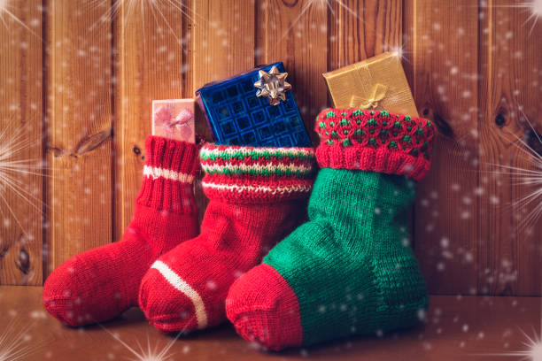 Christmas stockings on wooden background. Vintage style