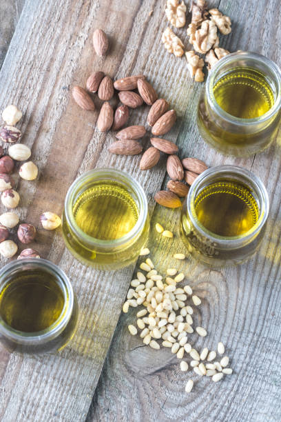 istock Glass jars with different kinds of nut oil 888229658