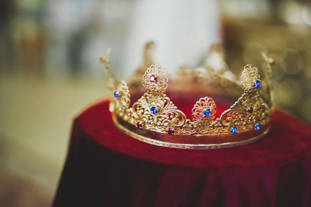 istock Golden crowns lying on the table in church 888235636