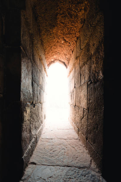 istock Bright light from the window of a stone building 888236372