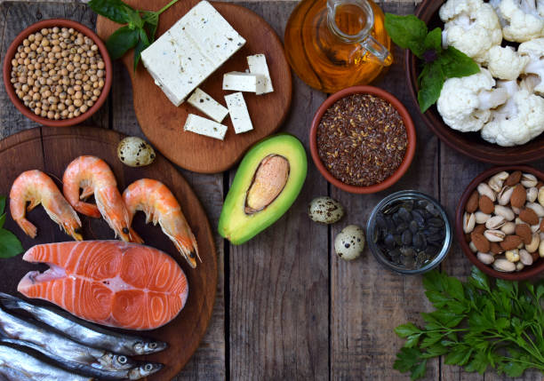 istock Composition of products containing unsaturated fatty acids Omega 3 - fish, nuts, tofu, avocado, eggs, soybeans, flax, pumpkin seeds, cauliflower, dill, vegetable oil. Top view. Healthy food 888239804