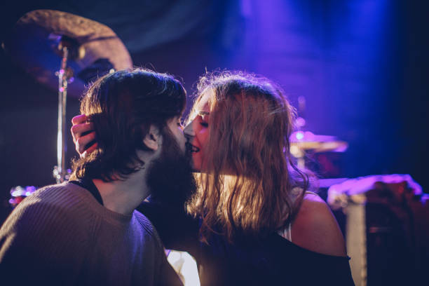 Feel the love at the club Couple practicing as a band, before the performance in the club. kiss entertainment group stock pictures, royalty-free photos & images