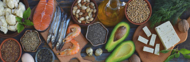 istock Composition of products containing unsaturated fatty acids Omega 3 - fish, nut, tofu, avocado, egg, soybean, flax, pumpkin seeds, chia, hemp, cauliflower, dill, vegetable oil. Top view. Healthy food 888266928