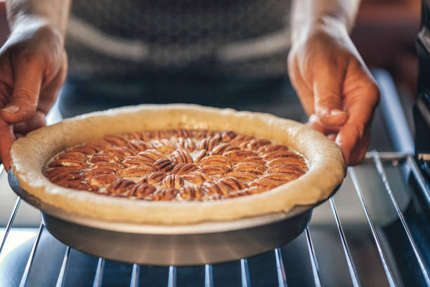 istock Baking Pecan Pie in The Oven for Holidays 888271546