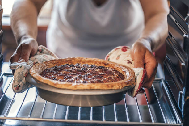 istock Baking Pecan Pie in The Oven for Holidays 888273706