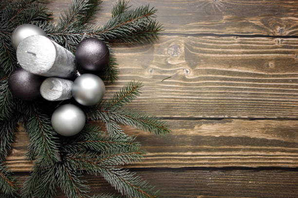 istock Christmas composition with candles, balls and snowy pine twigs on table 888274250