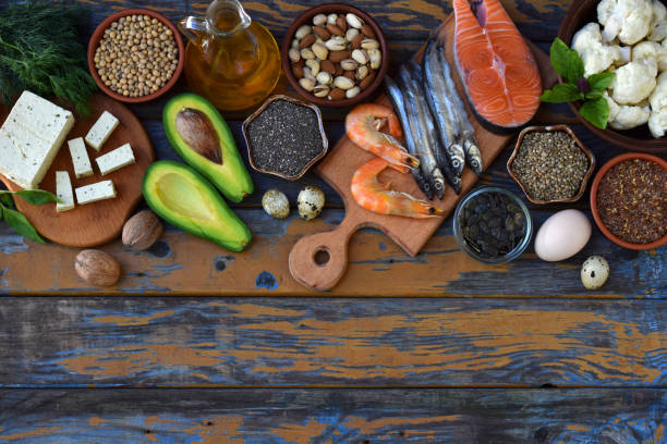 istock Composition of products containing unsaturated fatty acids Omega 3 - fish, nut, tofu, avocado, egg, soybean, flax, pumpkin seeds, chia, hemp, cauliflower, dill, vegetable oil. Top view. Healthy food 888287396