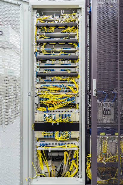 istock Inside the cabinet with switchboard and other telecommunication mobile network equipment with many cables 888304006