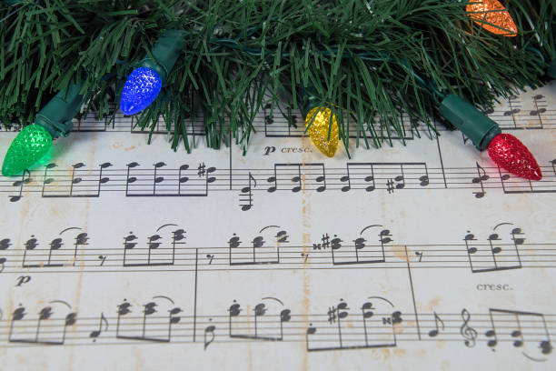 istock sheet music with holiday lights and garland 888307466
