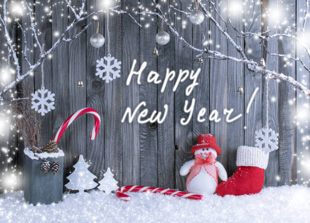istock Christmas interior with decorative branches, snowman, Santa boot,  presents and candy canes 888321542