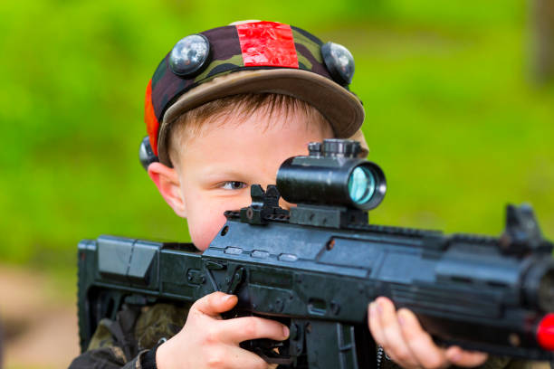 istock Boy with a gun playing laser tag 888324836