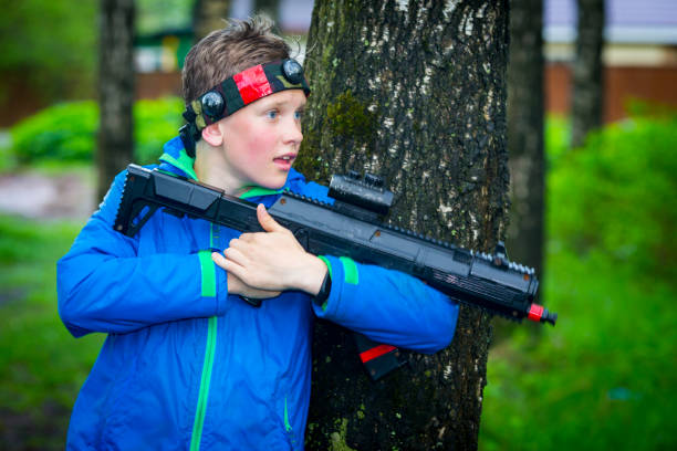 istock Boy with a gun playing laser tag 888331530